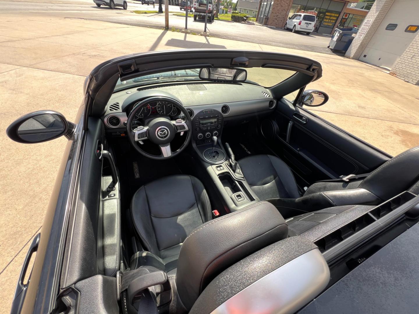 2012 Brilliant Black with Brilliant Black Hard Top /Black Leather Interior Mazda MX-5 Miata Grand Touring PRHT (JM1NC2PF6C0) with an 2.0L L4 DOHC 16V engine, 6-Speed Automatic transmission, located at 104 1st Avenue, Silvis, IL, 61282, (309) 755-9511, 41.515156, -90.425377 - Photo#3
